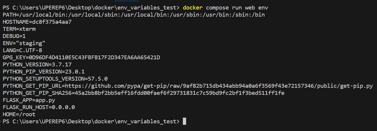 docker compose run web env